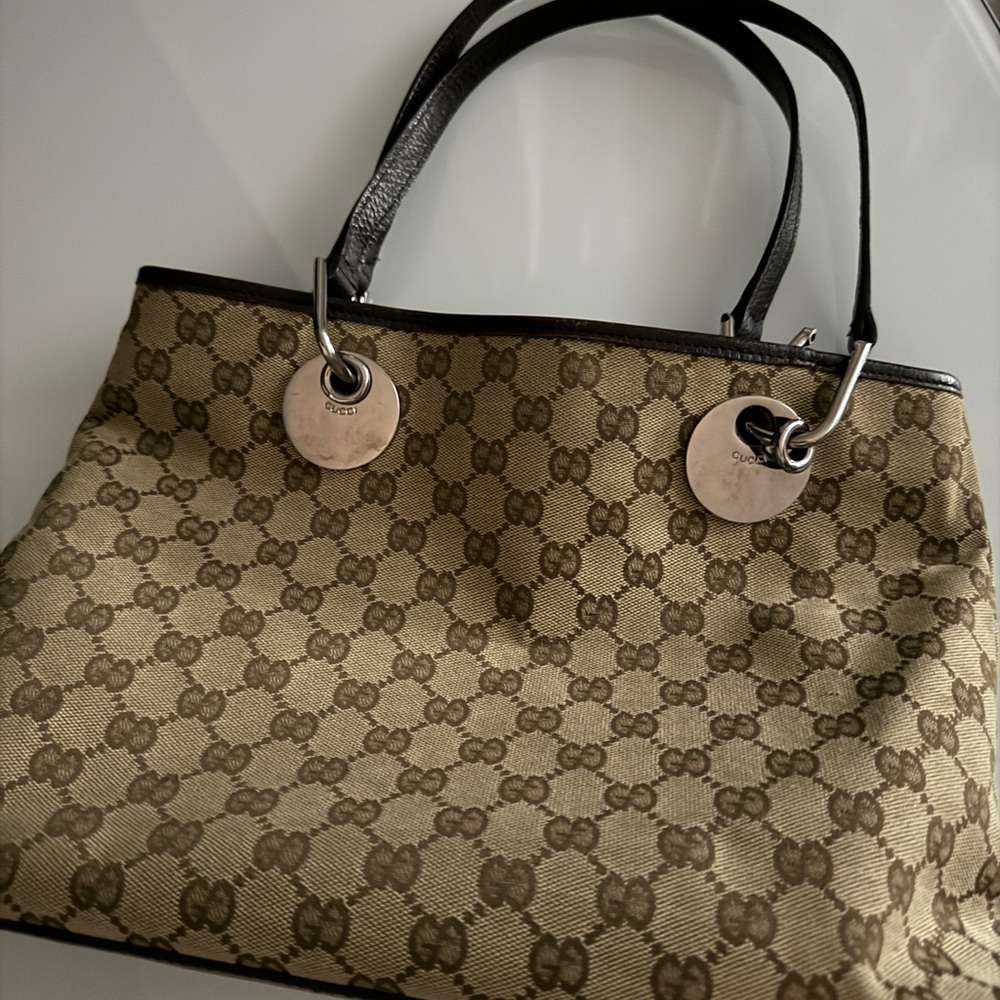 Authentic Gucci Tote in need of small repair on handle sold as is
